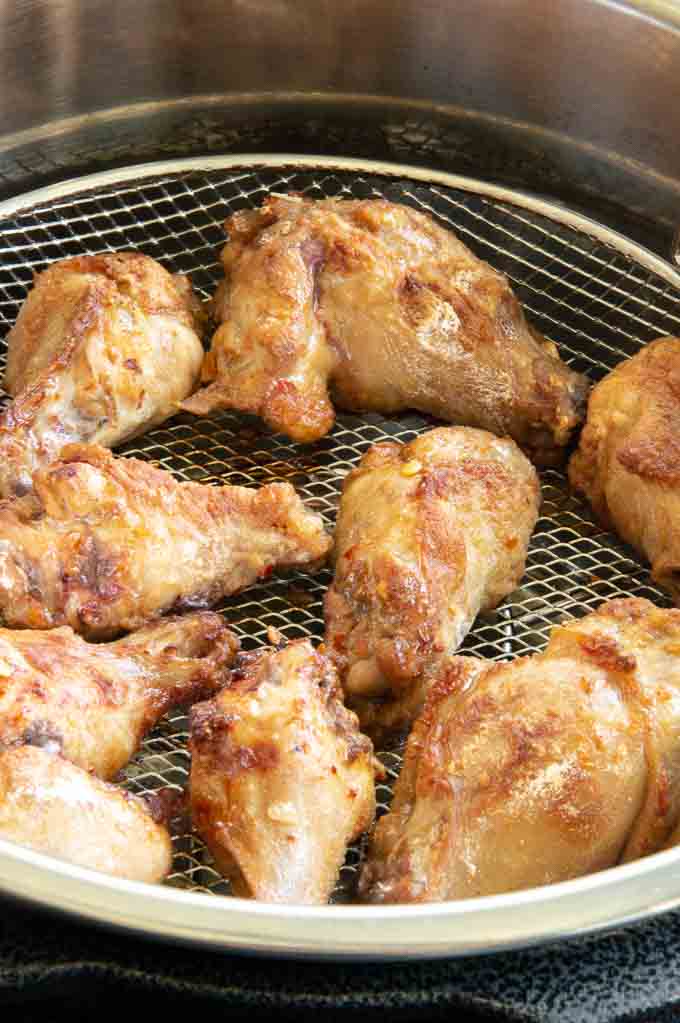 Partially cooked chicken wings in the airfryer