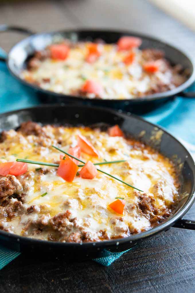 Individual servings of tamale pie in black cast iron