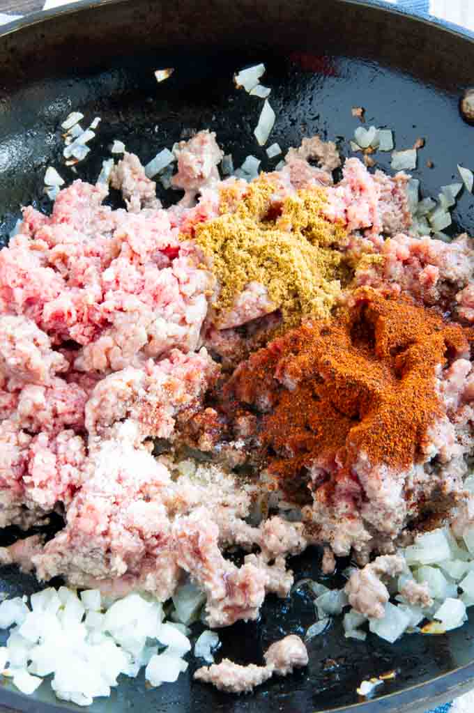 Ground Beef, sautéed onions and spices being grilled for tamale bake