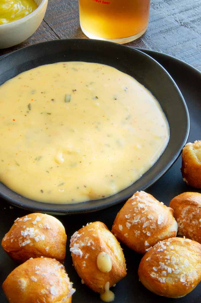 soft pretzels around a cheese sauce on a plate