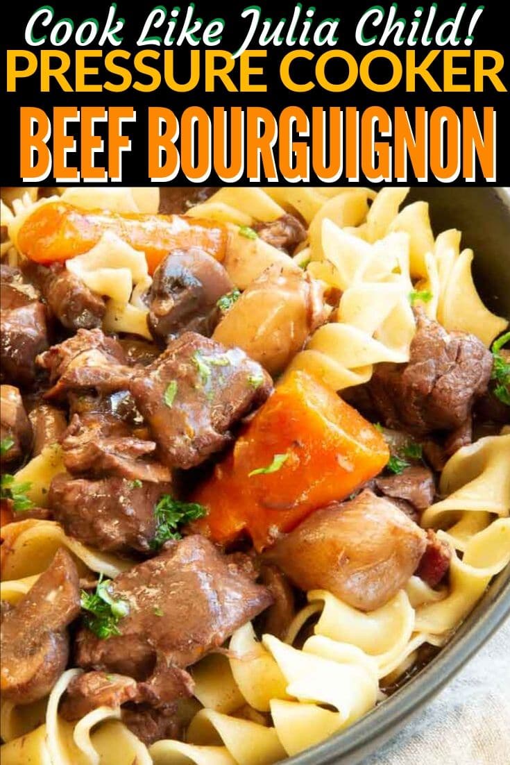 close up carrots, beef and noodles in a pan