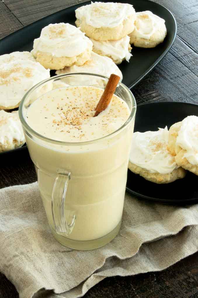 serving eggnog at the party with cookies