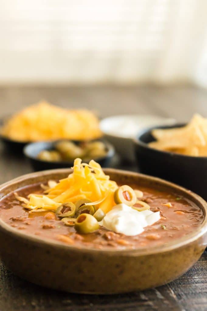 Bowl of chili topped with cheese