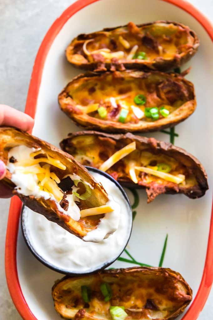 Dipping air fryer potato skins in sour cream