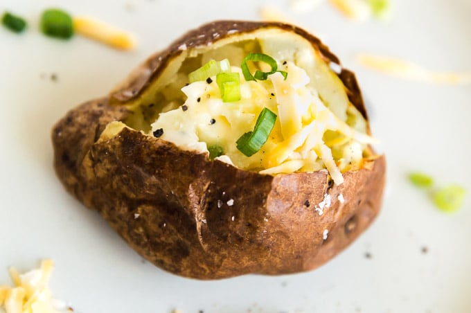 air fried baked potato on a white plate