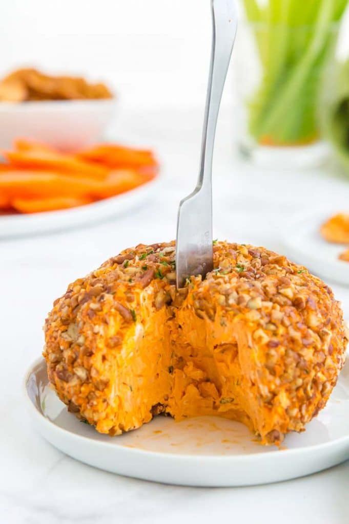 buffalo cheese ball with a wedge missing