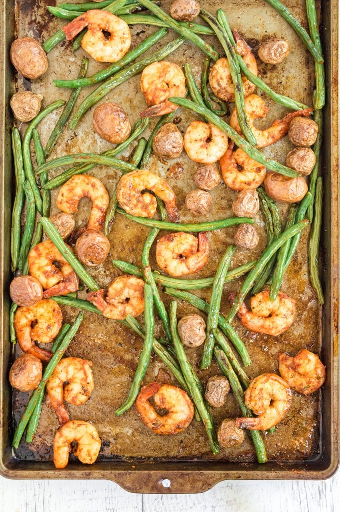 sheet pan shrimp tossed on a tray