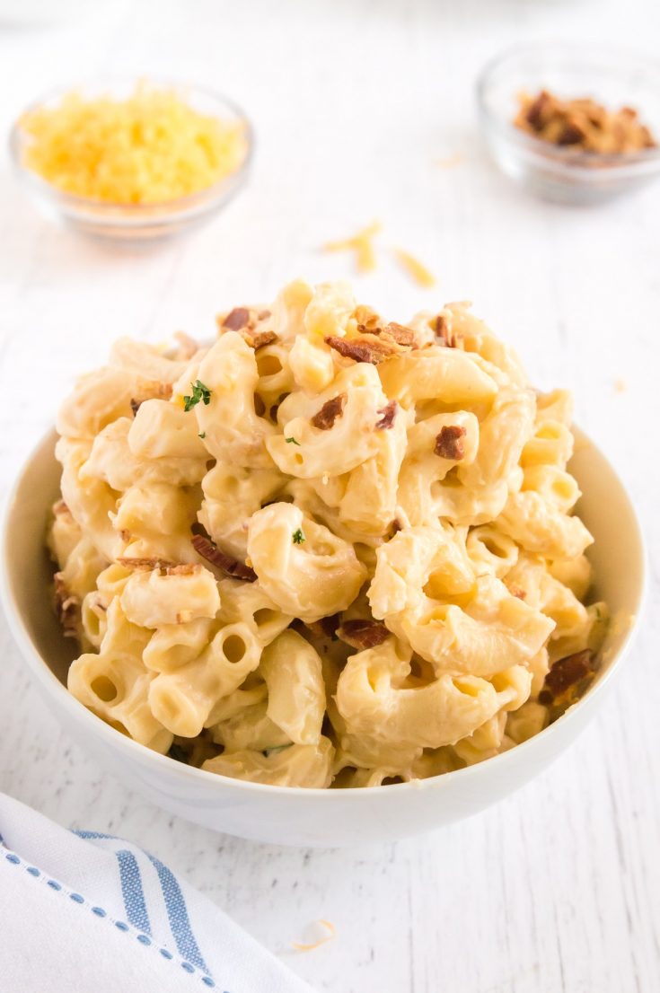 bowl full of pasta topped with bacon