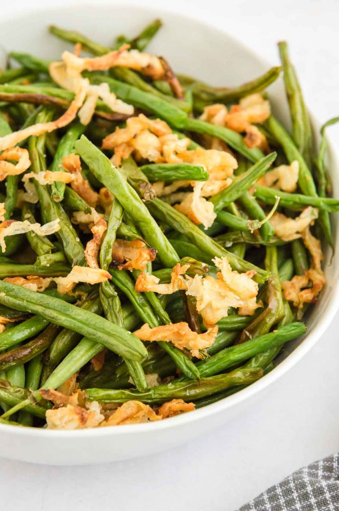 bowl of fresh green bean casserole with onions
