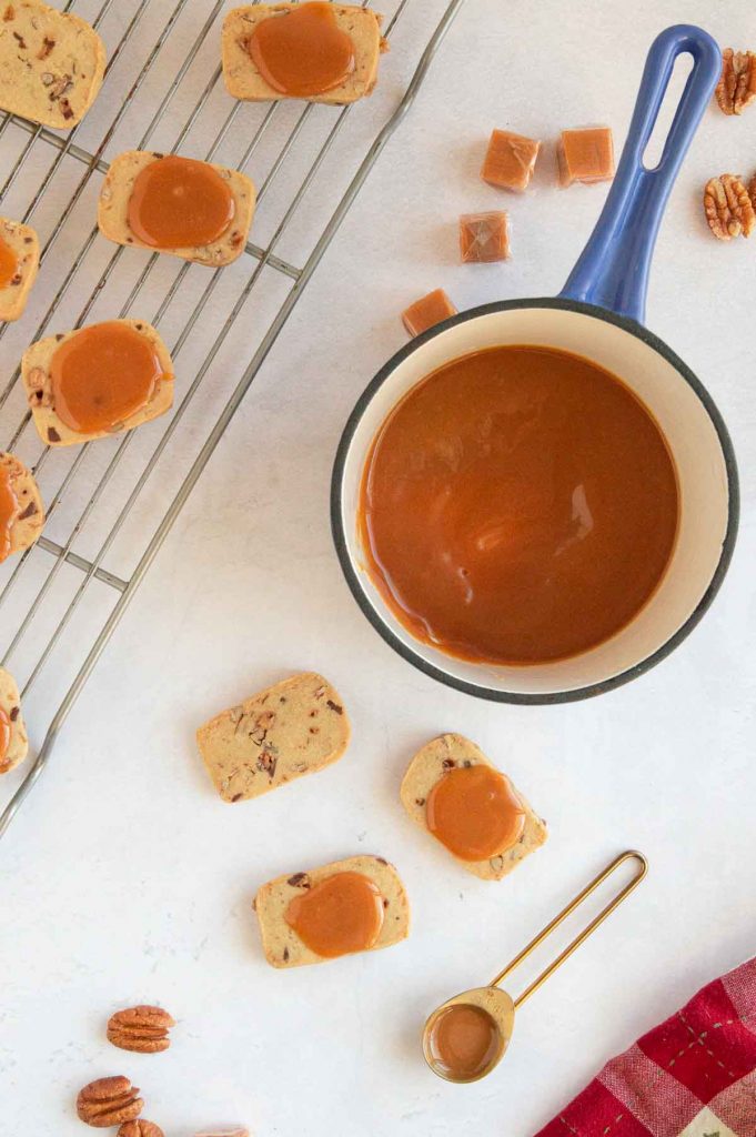 Spooning caramel onto cookies