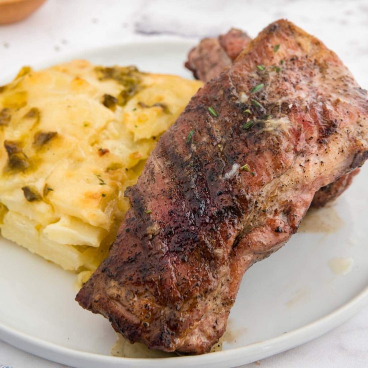 grilled spare ribs on a white plate