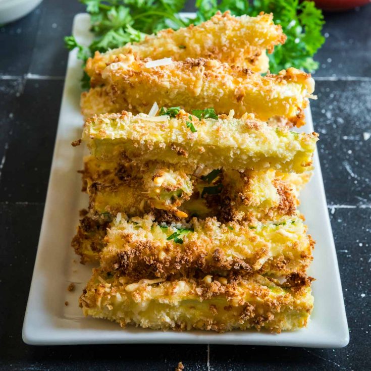 tray with stacked parmesan zucchini sticks