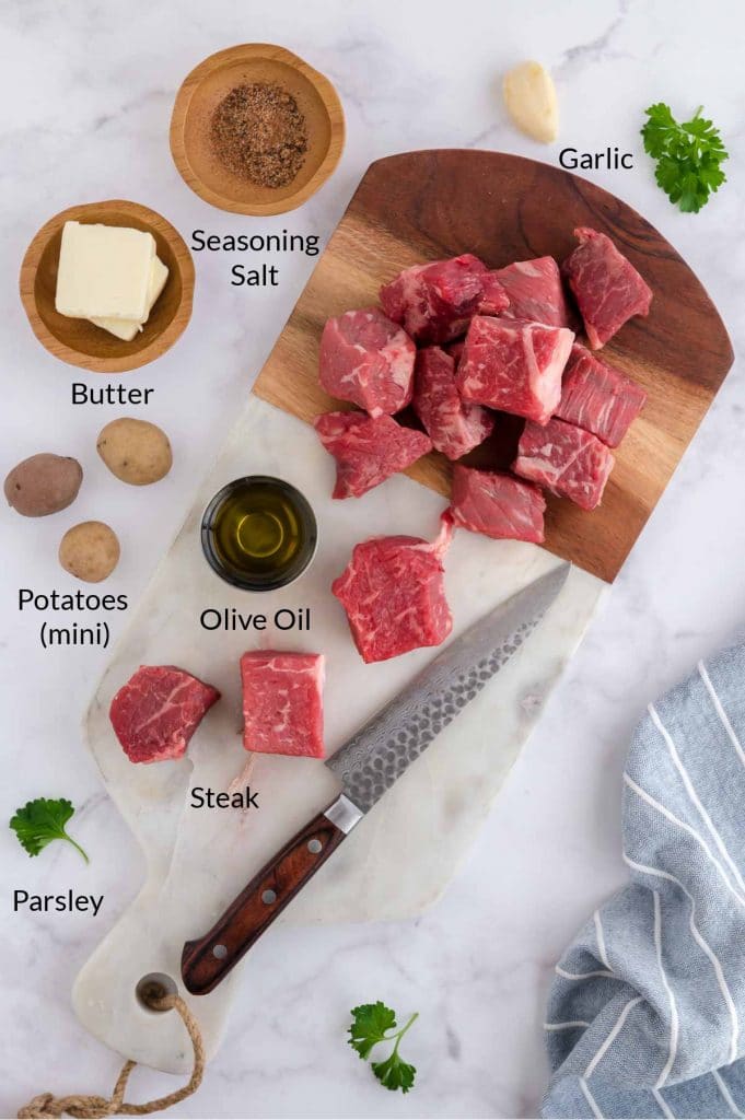ingredients to make steak tips on a table