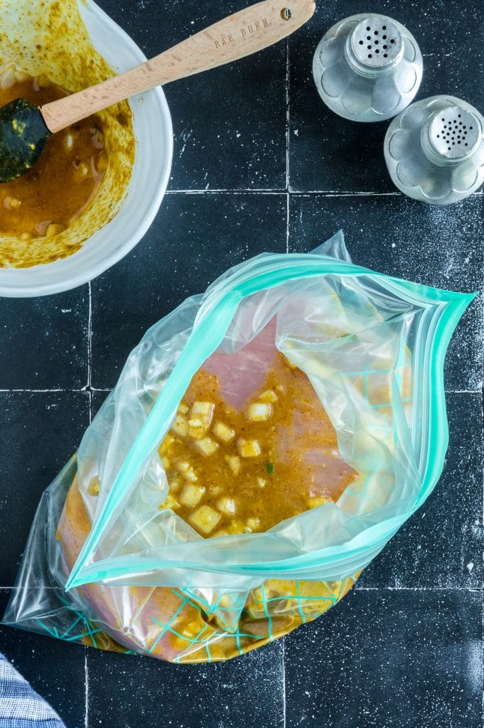 pork in a plastic bag with a marinade