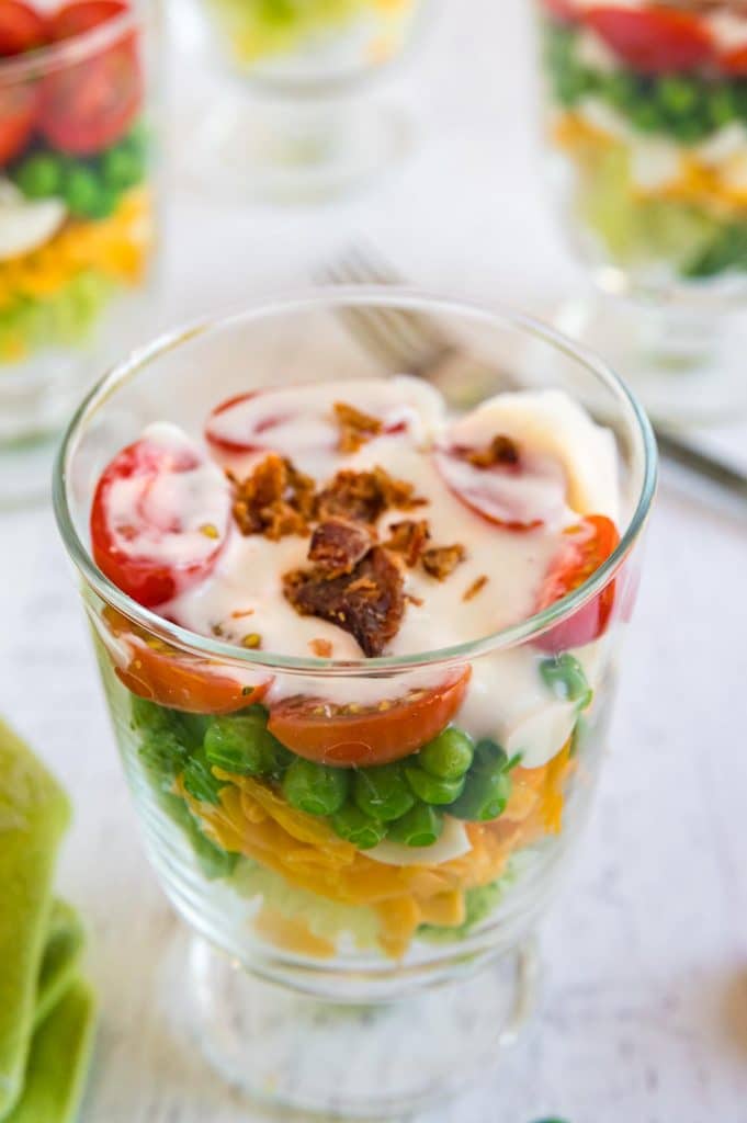 7 layer pea salad in an individual trifle