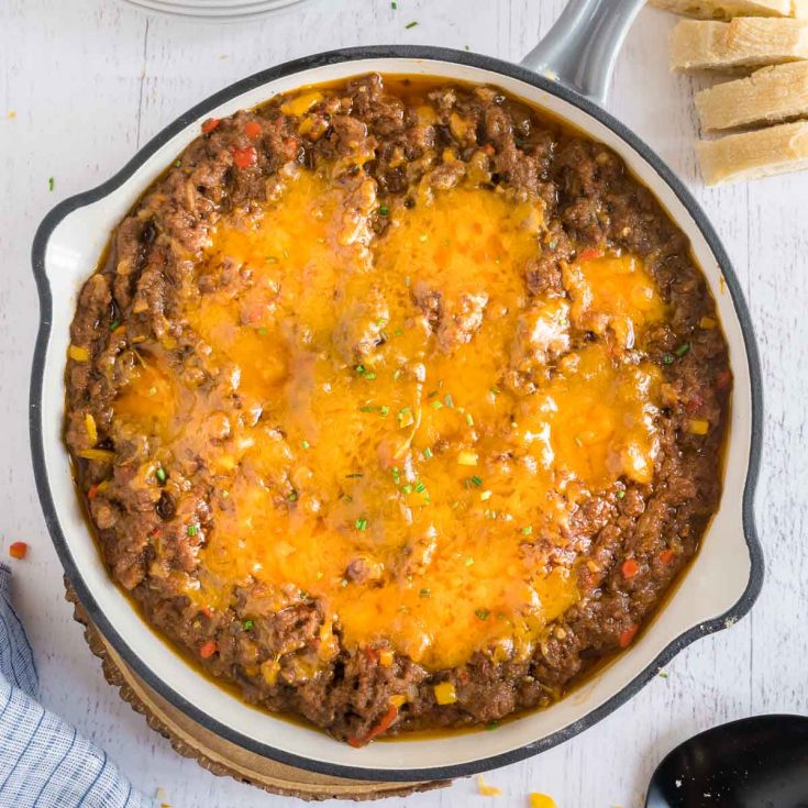 SKILLET with sloppy joe dip next to bread slices