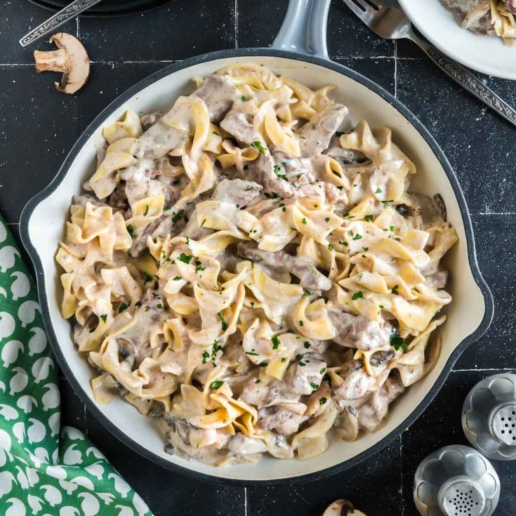 close up of noodles and beef in the stroganoff hot dish