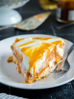 no-bake pumpkin cheesecake pie with salted caramel over the top